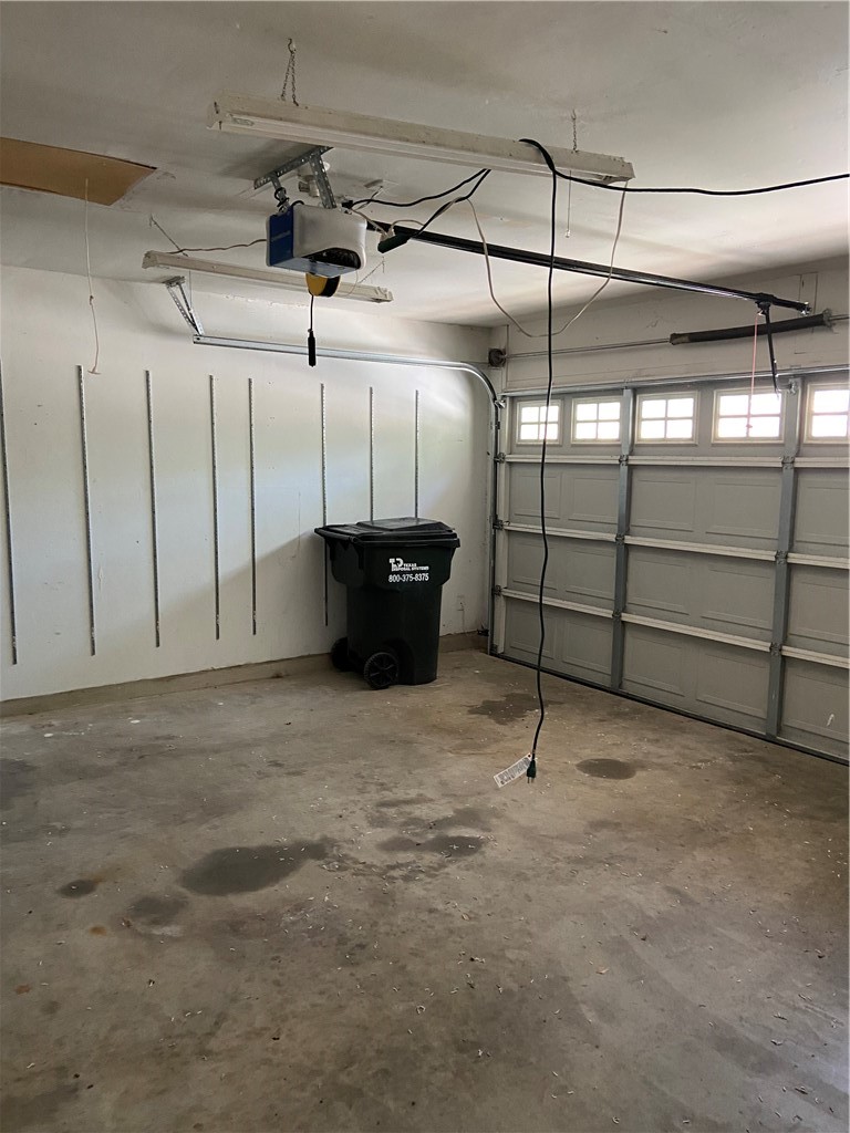 1257 Pine Portage Loop Leander, TX 78641 - Photo 30 of 32 Garage with a garage door opener