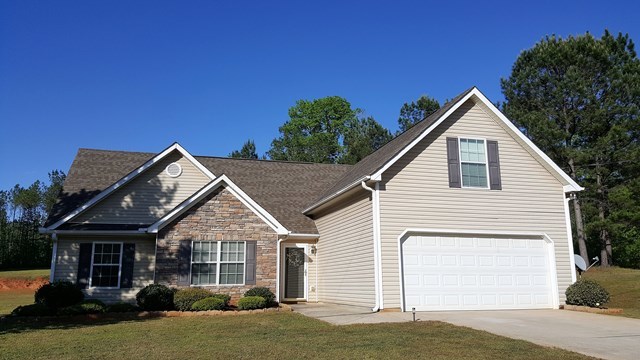3335 Trotters Ridge Trail Gray, GA 31032 - Photo 1 of 25 a view of a house with a yard and plants