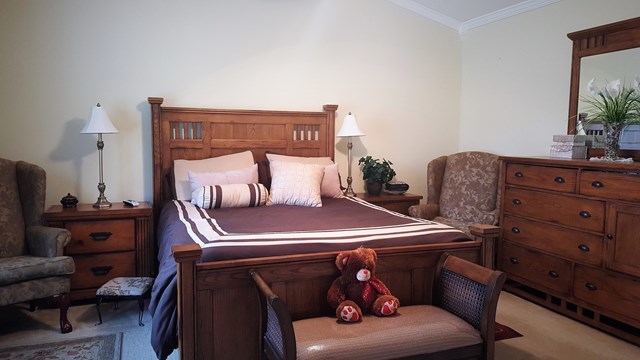 3335 Trotters Ridge Trail Gray, GA 31032 - Photo 14 of 25 a bedroom with a bed and a couch