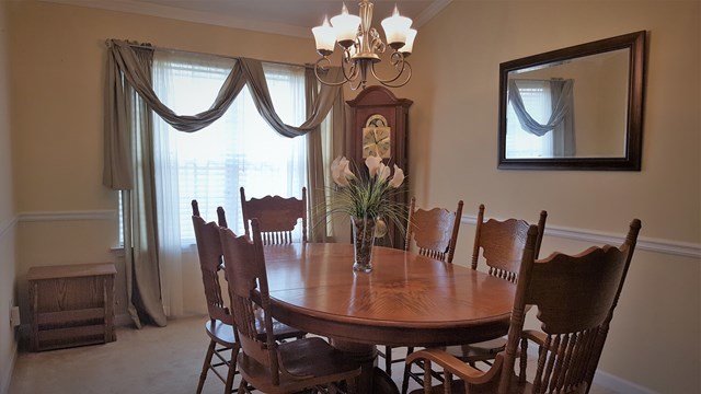 3335 Trotters Ridge Trail Gray, GA 31032 - Photo 5 of 25 a dining room with furniture and a mirror