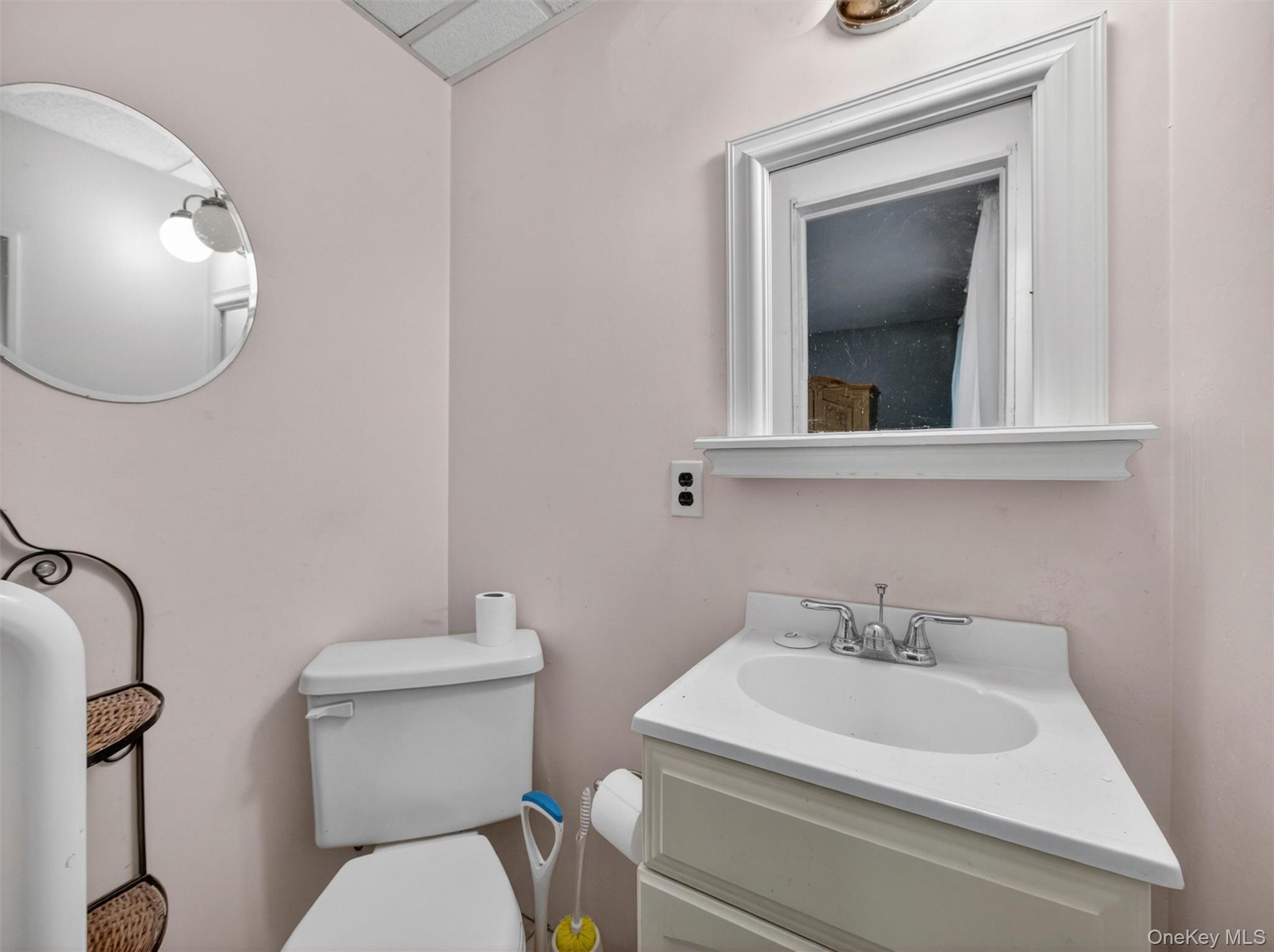 56 Oak Road New City, NY 10956 - Photo 16 of 30 a bathroom with a toilet sink and mirror