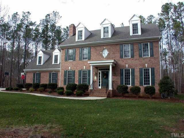 2312 Sunnystone Way Raleigh, NC 27613 - Photo 1 of 1 a front view of a house with garden