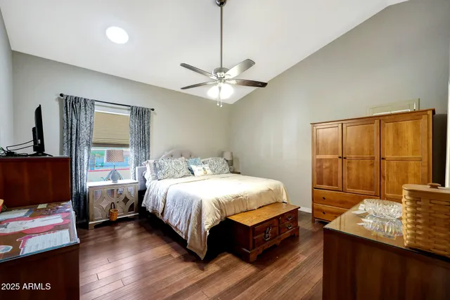 a bedroom with a bed and a window