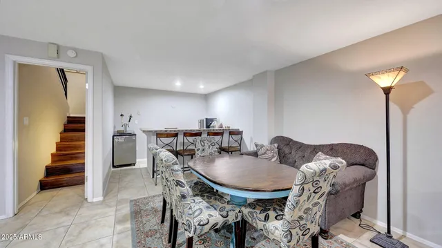 a dining room with furniture and entryway