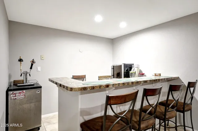 a kitchen with a table and chairs in it
