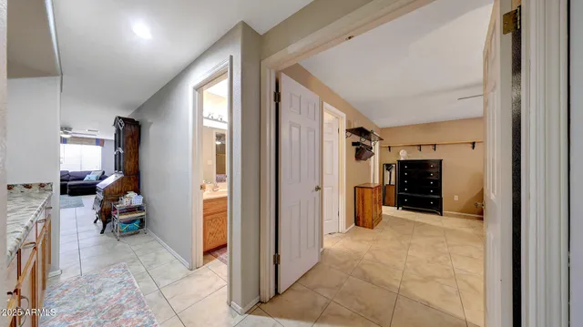 a view of a livingroom with furniture and a bedroom