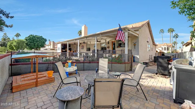 a view of a chairs and table in the patio