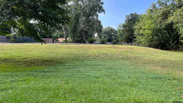 a view of outdoor space with deck and trees