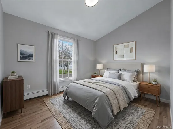 a view of an empty room and wooden floor
