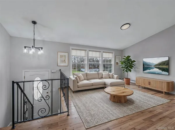 a living room with furniture and a table