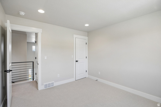 11781 South Halls Crk Road Draper, UT 84020 - Photo 29 of 33 Carpeted room featuring light gray walls, white trim, and recessed lighting