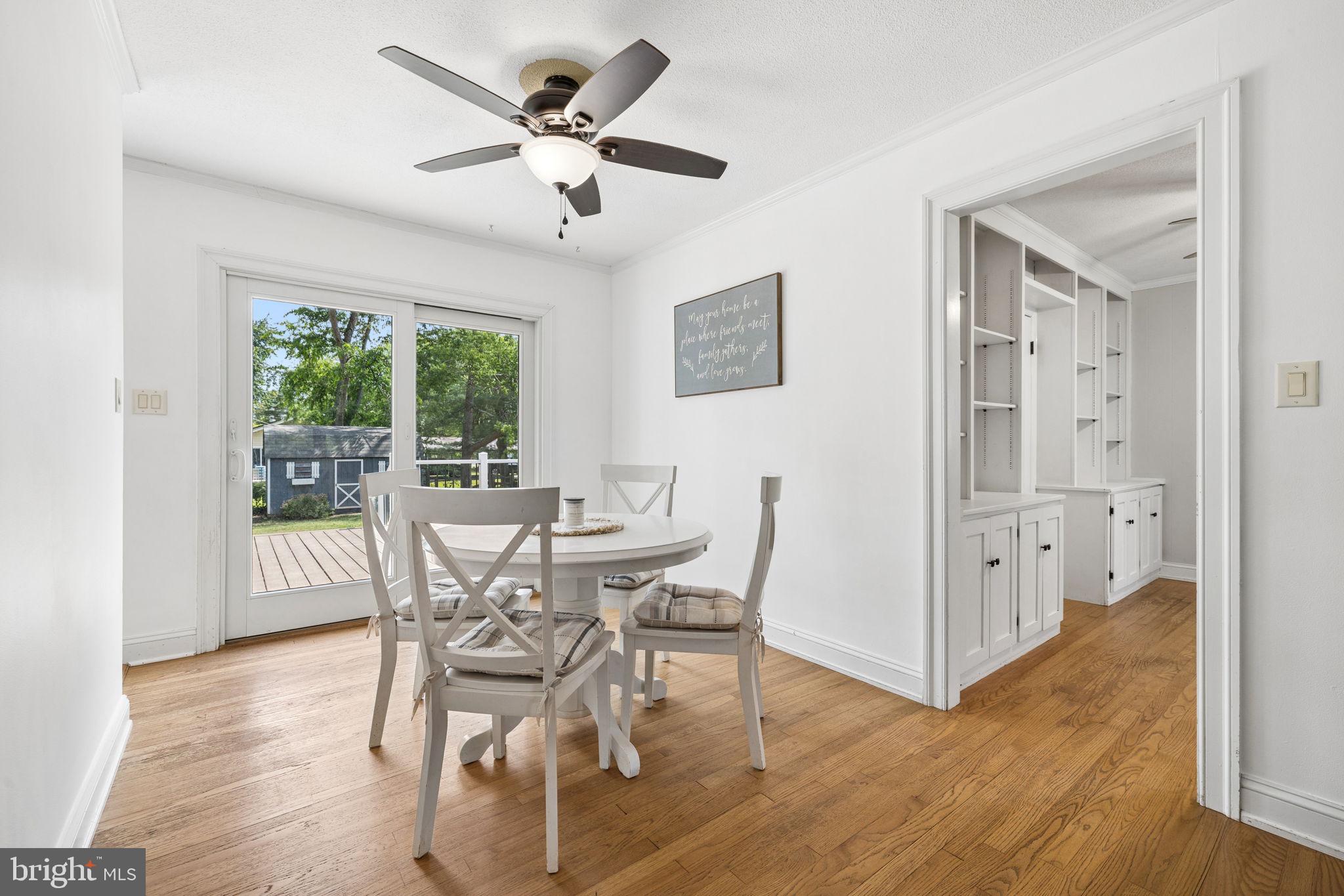 12237 Randle Lane Culpeper, VA 22701 - Photo 6 of 31 a view of a dining room with furniture window and wooden floor