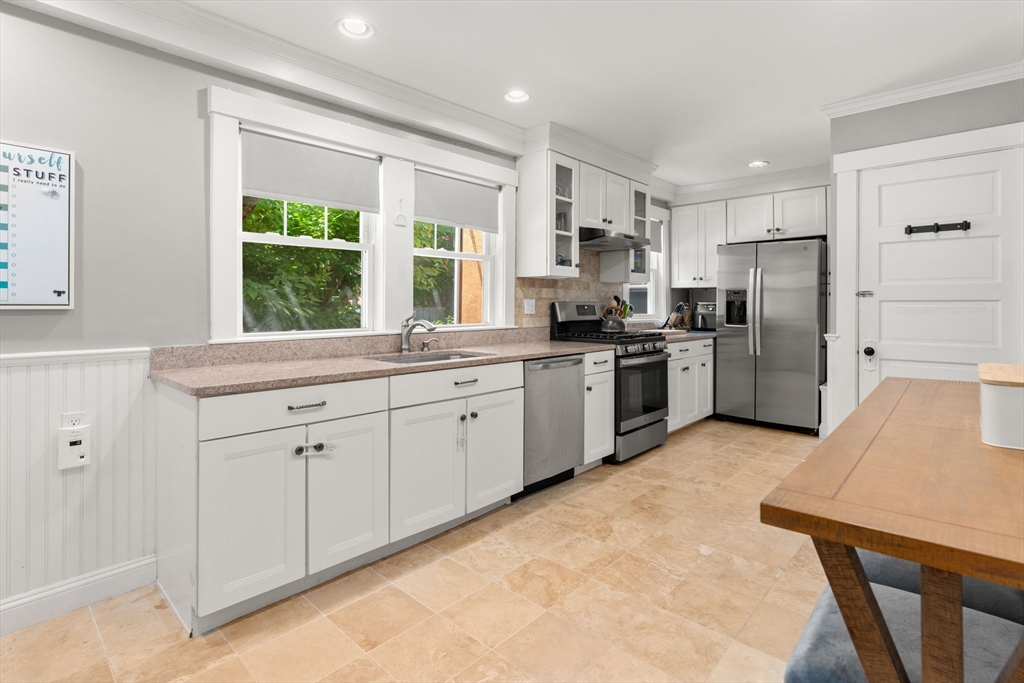 17 Maple Street, Unit 17 Needham, MA 02492 - Photo 11 of 24 a kitchen with a sink a refrigerator and window