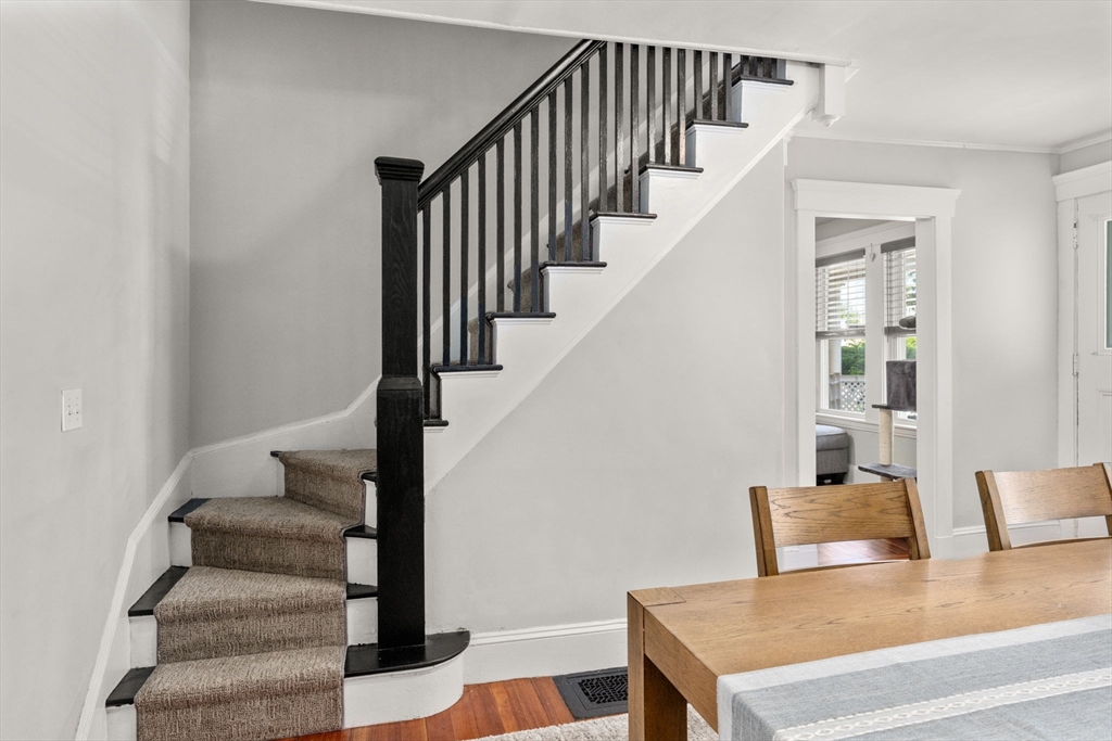 17 Maple Street, Unit 17 Needham, MA 02492 - Photo 14 of 24 a view of entryway and hall with wooden floor