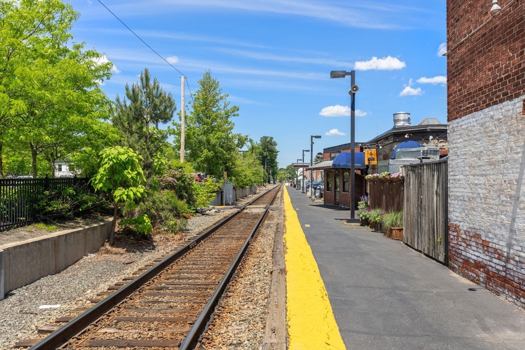17 Maple Street, Unit 17 Needham, MA 02492 - Photo 24 of 24 a view of a house with swimming pool