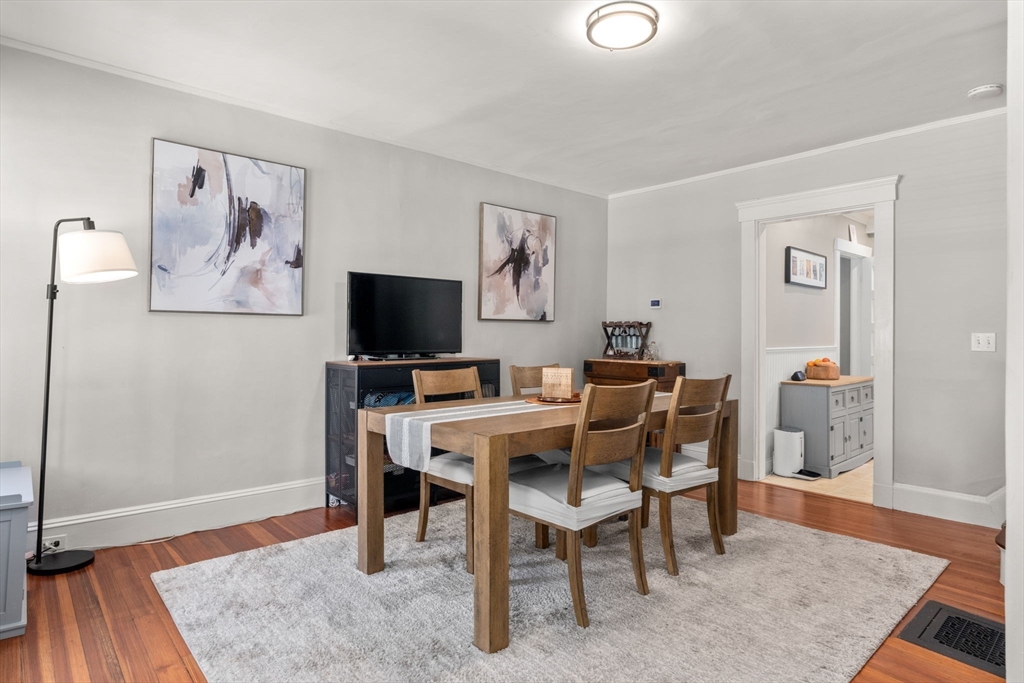 17 Maple Street, Unit 17 Needham, MA 02492 - Photo 5 of 24 a view of a livingroom with furniture and a flat screen tv