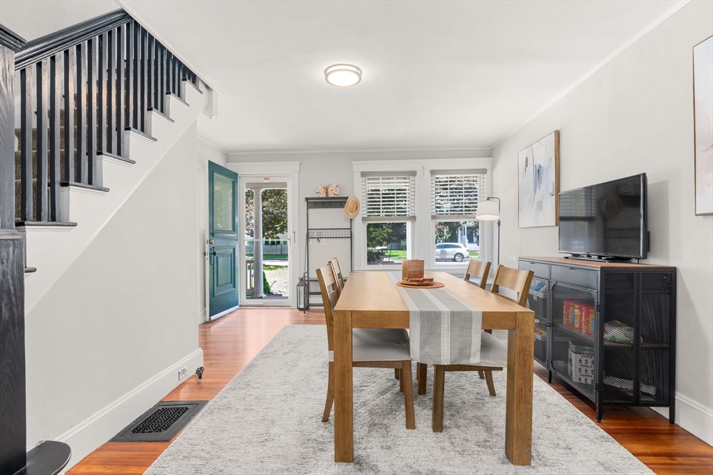 17 Maple Street, Unit 17 Needham, MA 02492 - Photo 7 of 24 a view of a dining room with furniture window and wooden floor