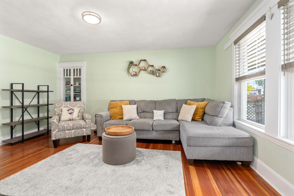 17 Maple Street, Unit 17 Needham, MA 02492 - Photo 9 of 24 a living room with furniture and a window