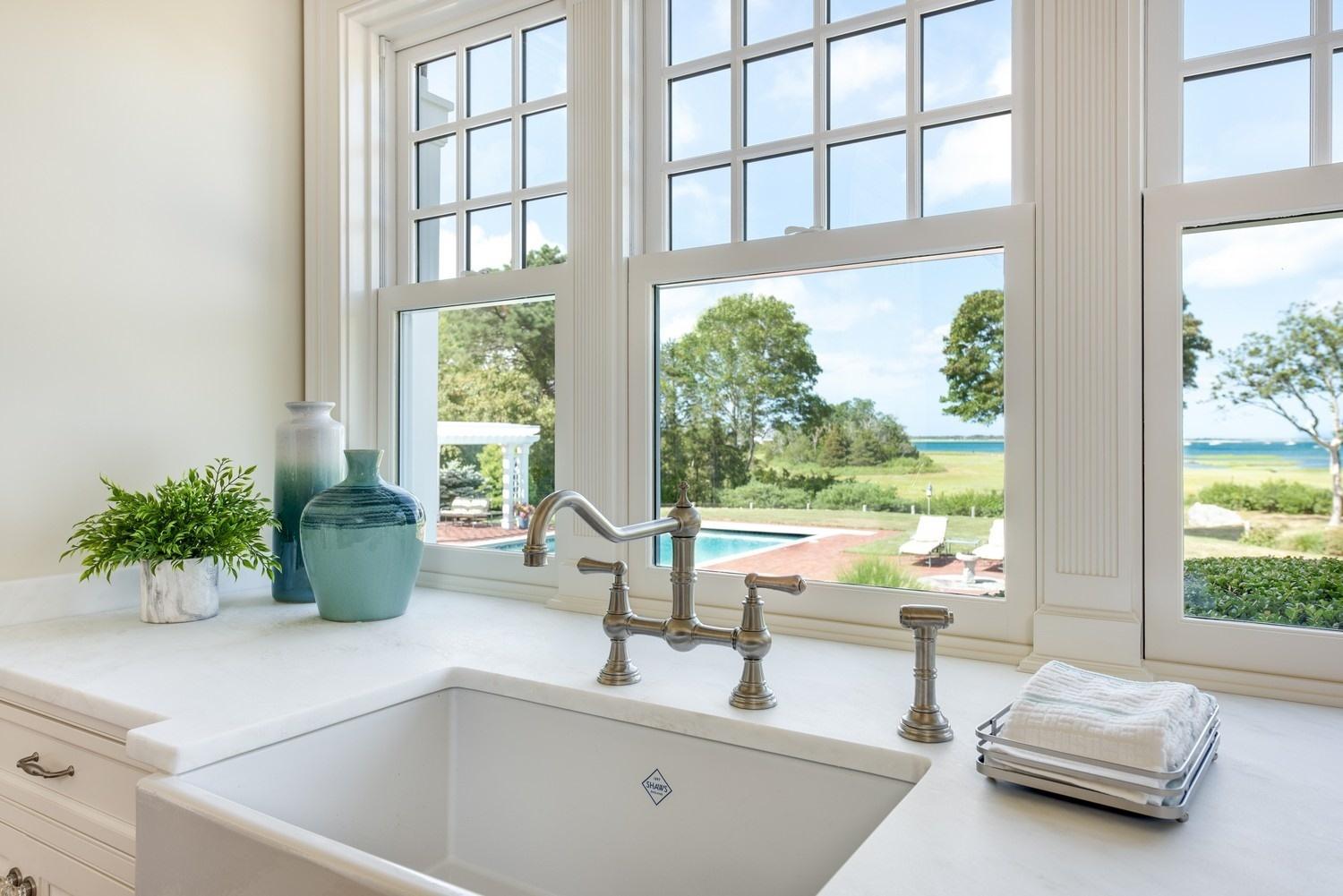 56 Rendezvous Lane Barnstable, MA 02630 - Photo 11 of 35 a kitchen with a sink and a large window