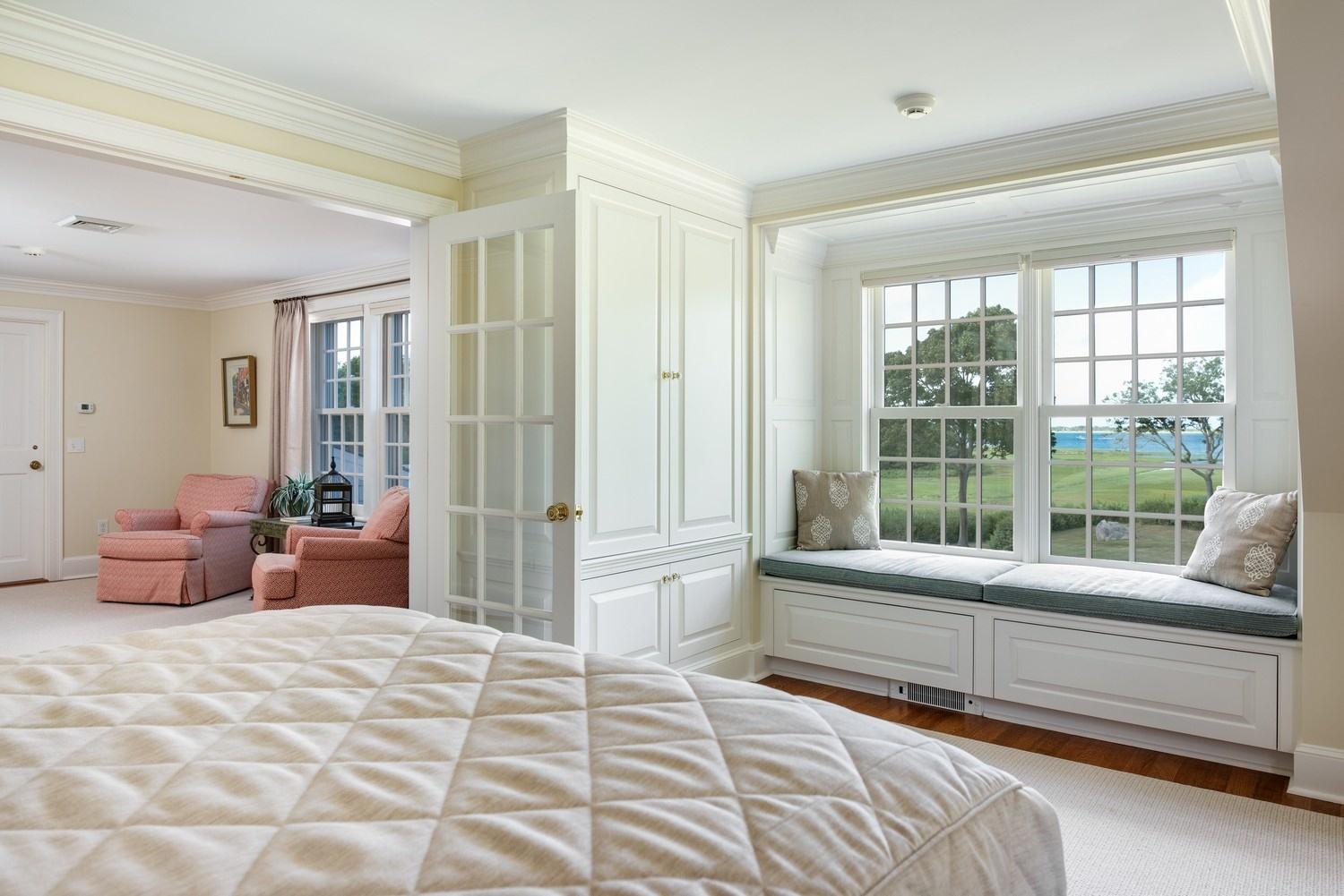 56 Rendezvous Lane Barnstable, MA 02630 - Photo 29 of 35 a bedroom with furniture and large windows