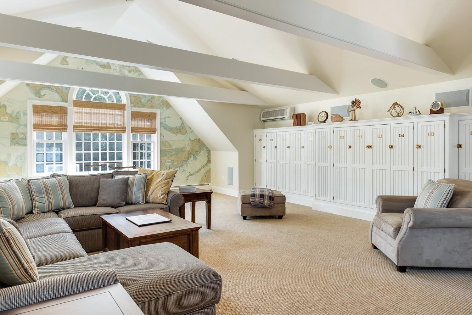 56 Rendezvous Lane Barnstable, MA 02630 - Photo 31 of 35 a living room with furniture and a large window