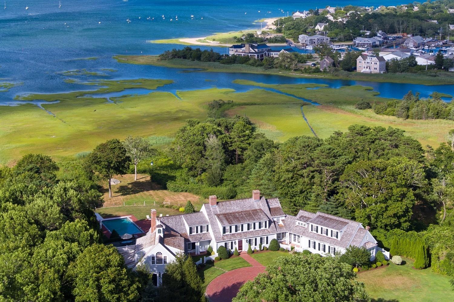 56 Rendezvous Lane Barnstable, MA 02630 - Photo 5 of 35 an aerial view of a house with a garden and lake view