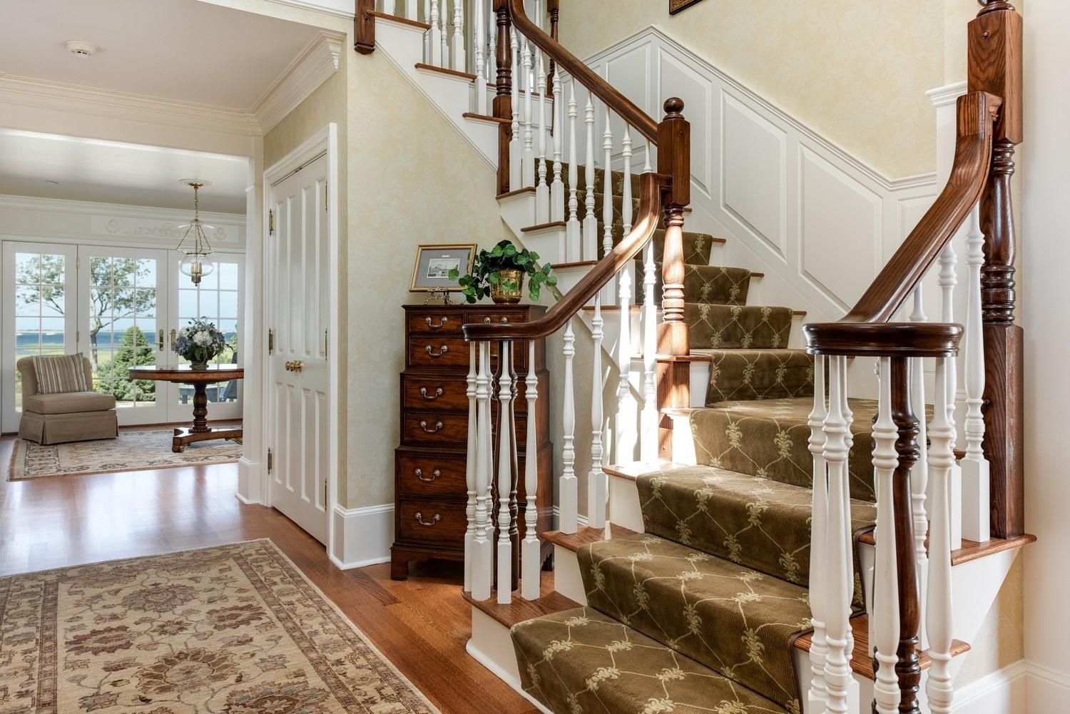 56 Rendezvous Lane Barnstable, MA 02630 - Photo 9 of 35 a view of an entryway with wooden floor and a livingroom