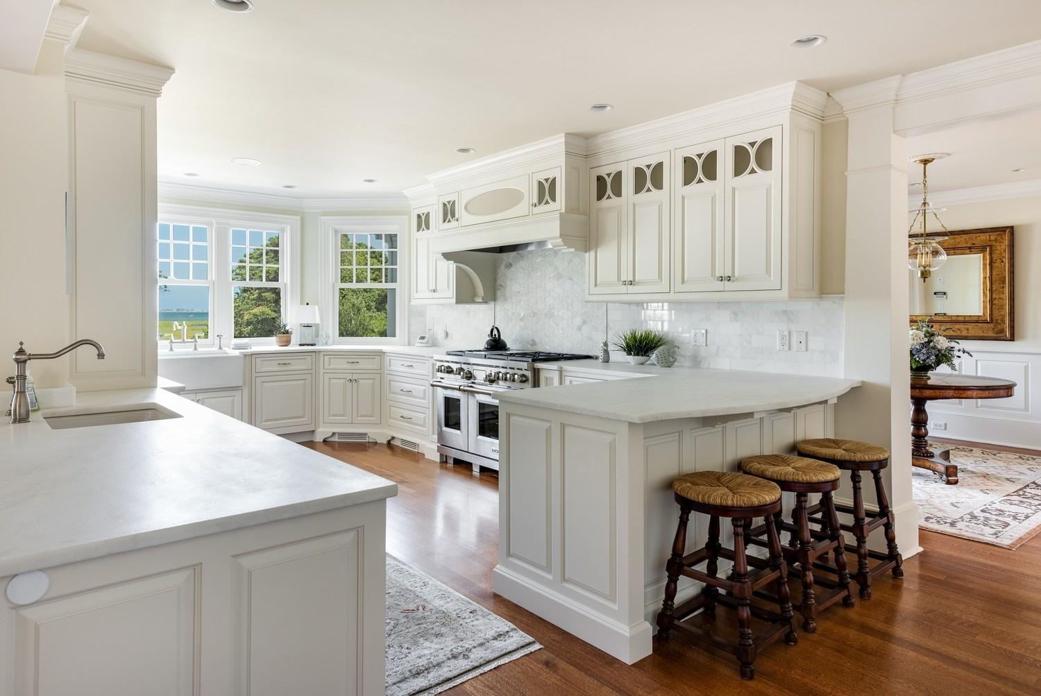 56 Rendezvous Lane Barnstable, MA 02630 - Photo 10 of 35 a kitchen with granite countertop a sink and a stove top oven