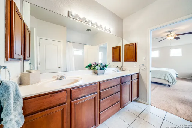 a spacious bathroom with a double vanity sink mirror and