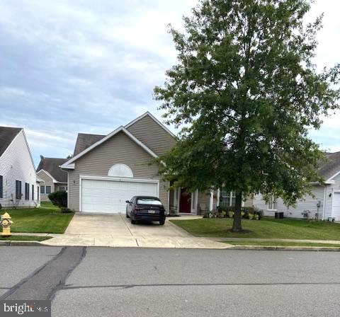 a car parked in front of white house