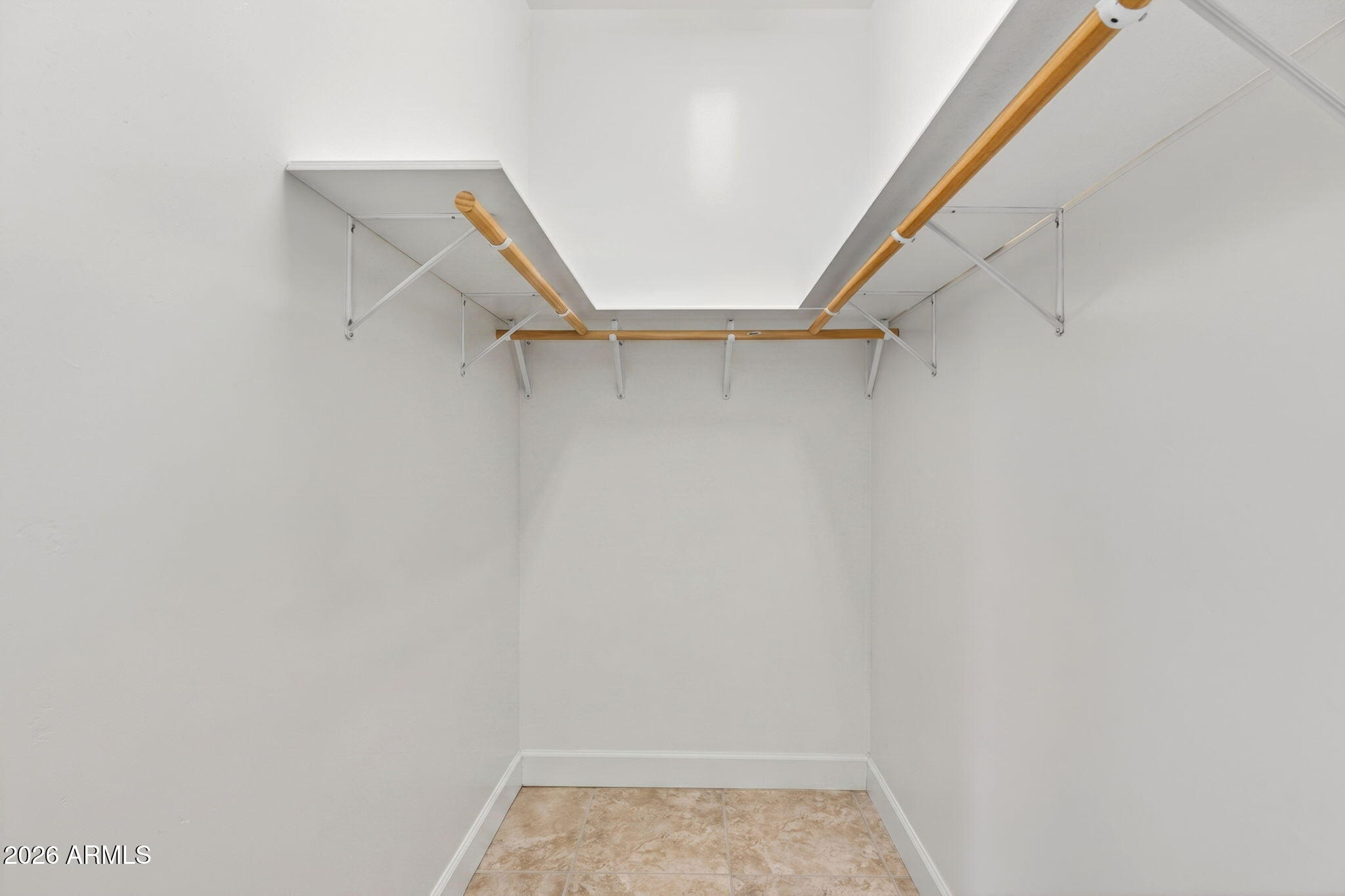 2929 West New River Road New River, AZ 85087 - Photo 23 of 53 a view of walk in closet with empty racks