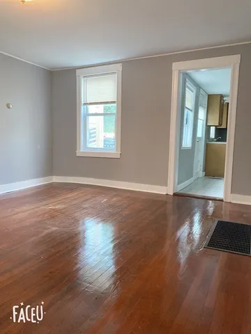 a view of livingroom with hardwood floor and a window