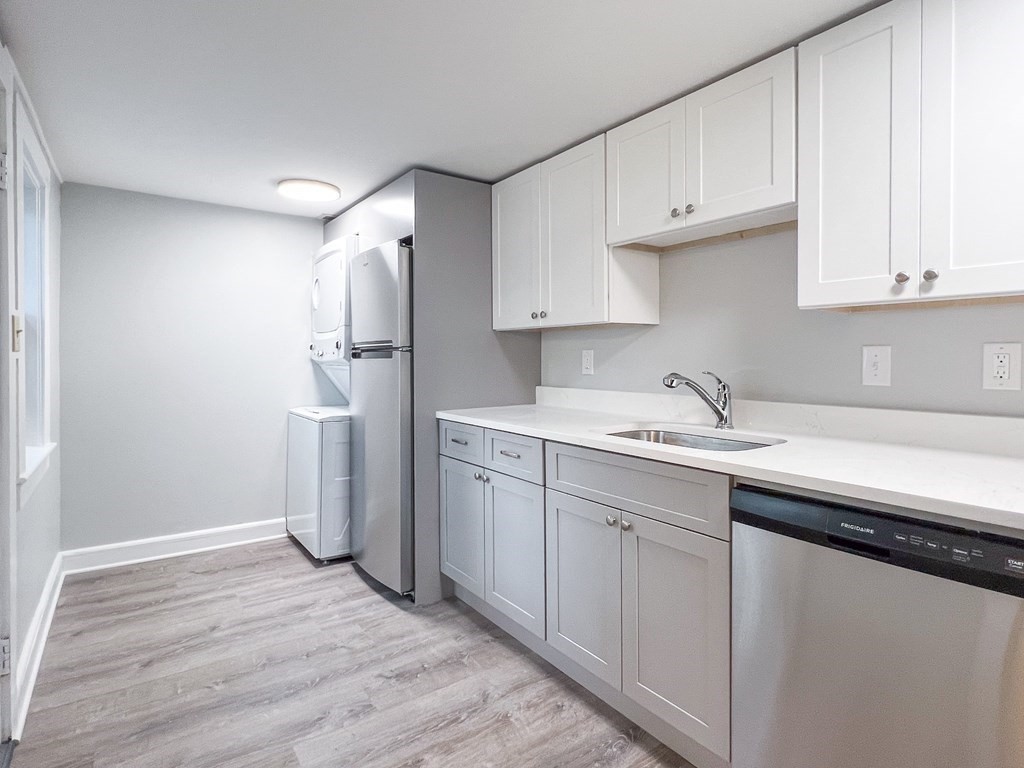 19-25 Common Street Weymouth, MA 02188 - Photo 23 of 41 a kitchen with white cabinets and refrigerator