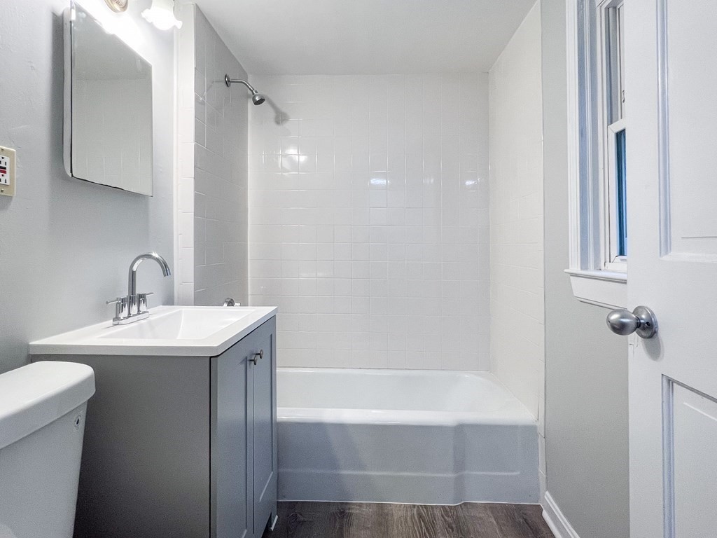 19-25 Common Street Weymouth, MA 02188 - Photo 26 of 41 a bathroom with a sink a toilet and shower