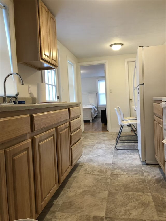 19-25 Common Street Weymouth, MA 02188 - Photo 38 of 41 a living room with furniture a mirror and a sink