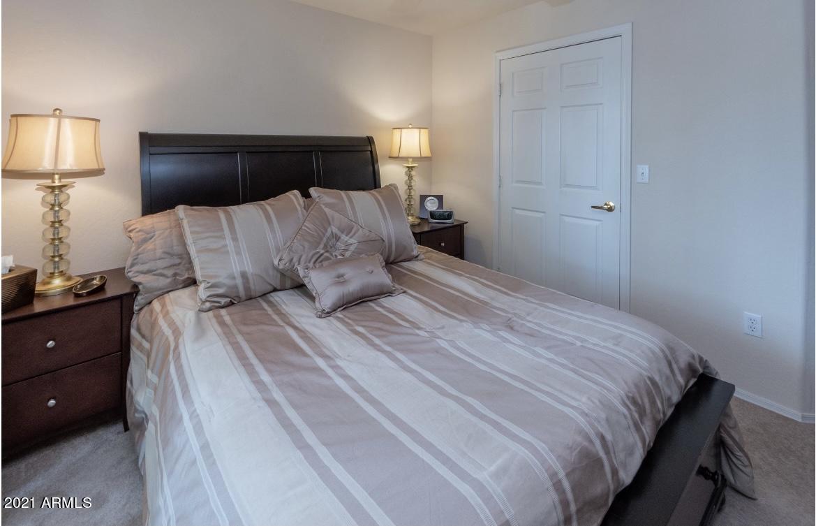 1287 North Alma School Road, Unit 249 Chandler, AZ 85224 - Photo 15 of 26 a large bed and a night stand