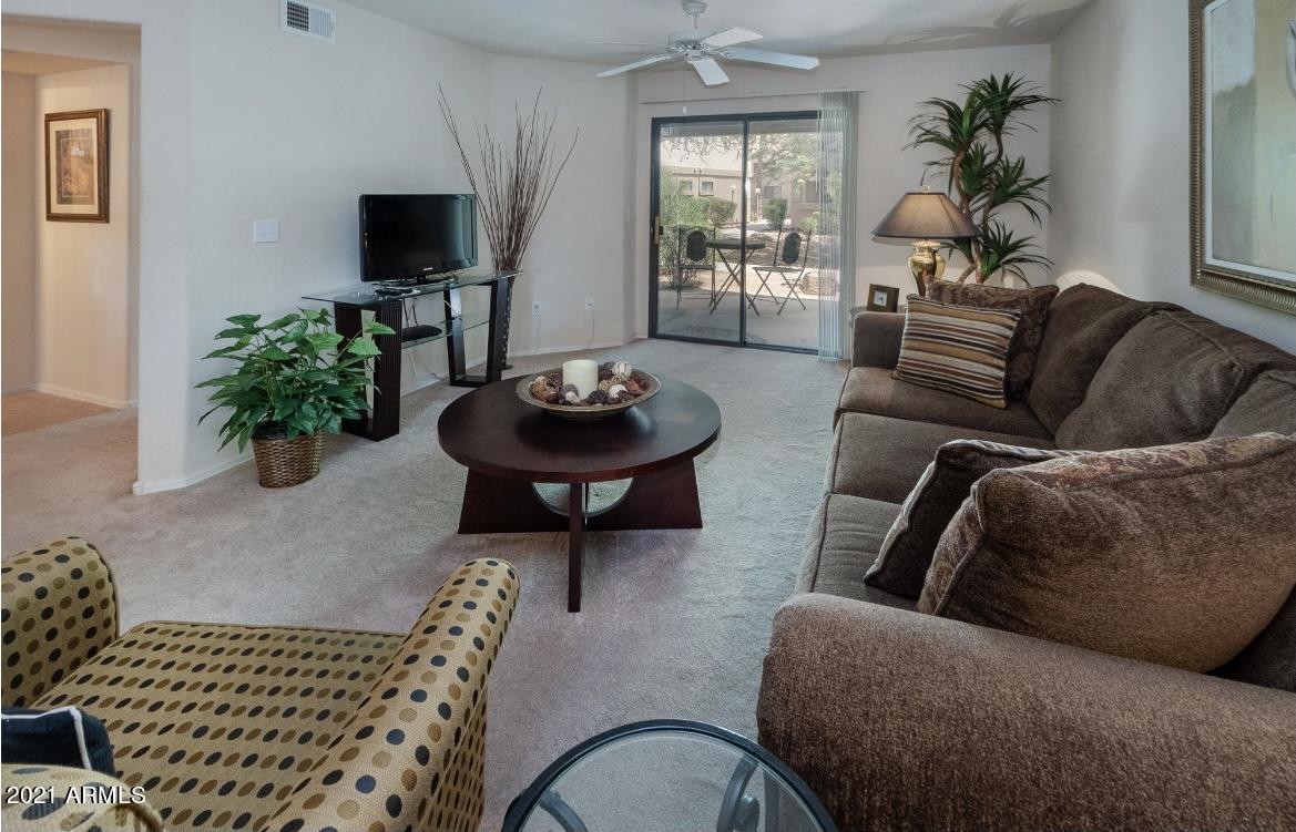 1287 North Alma School Road, Unit 249 Chandler, AZ 85224 - Photo 6 of 26 a living room with furniture and a potted plant