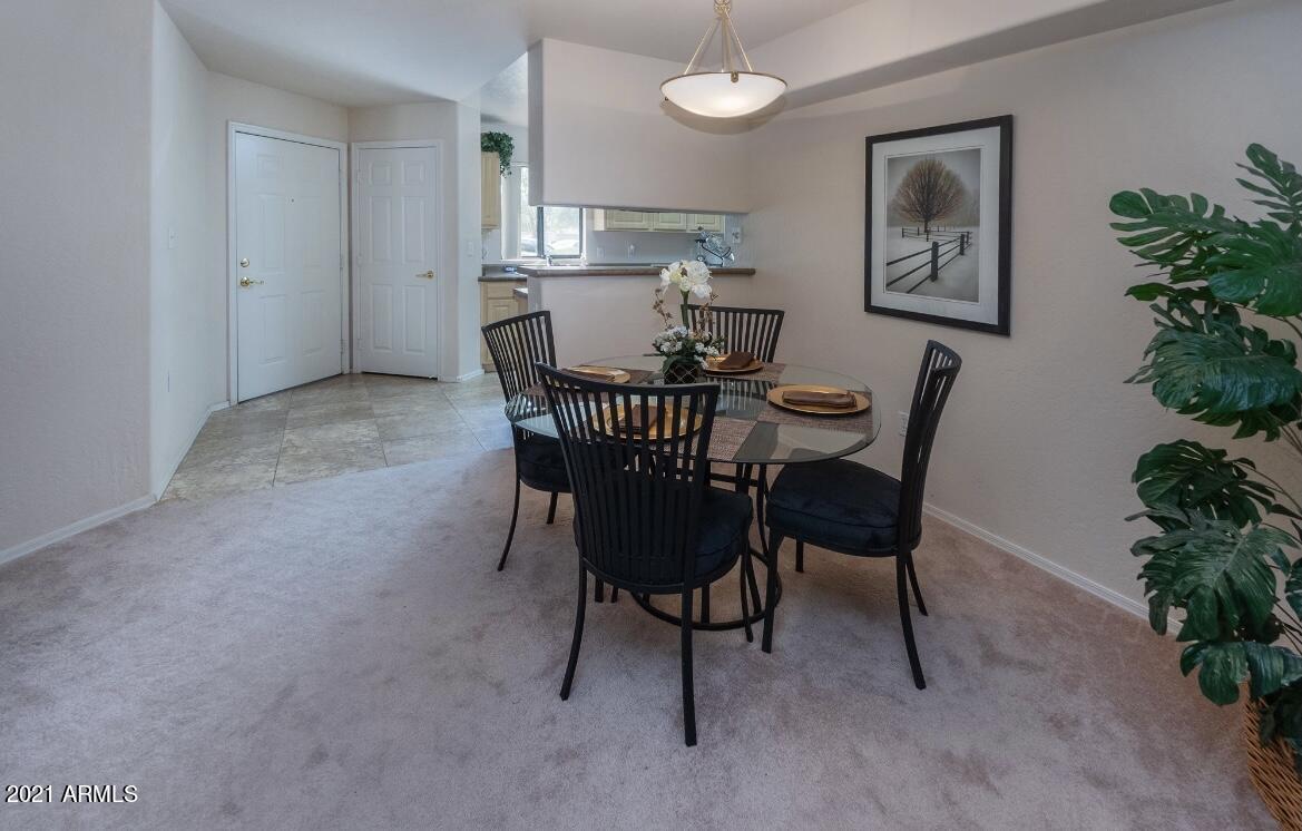 1287 North Alma School Road, Unit 249 Chandler, AZ 85224 - Photo 7 of 26 a view of a dining room with furniture