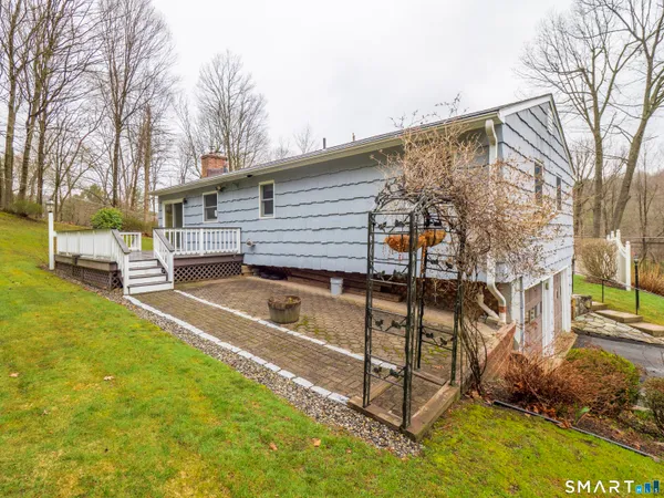 a view of a patio with a yard