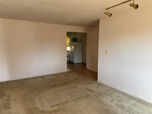a view of a room with an empty space