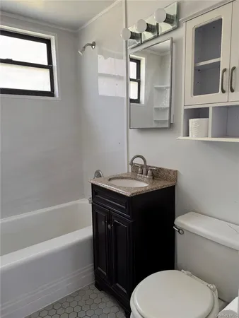 a bathroom with a sink toilet and bathtub