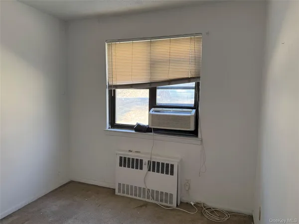 a view of wooden floor and windows in a room