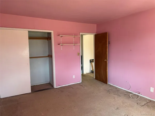 an empty room with closet