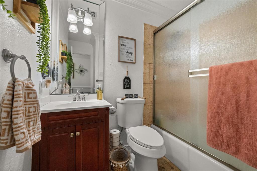 137 North Jessup Street Alvarado, TX 76009 - Photo 14 of 23 a bathroom with a sink a toilet and shower