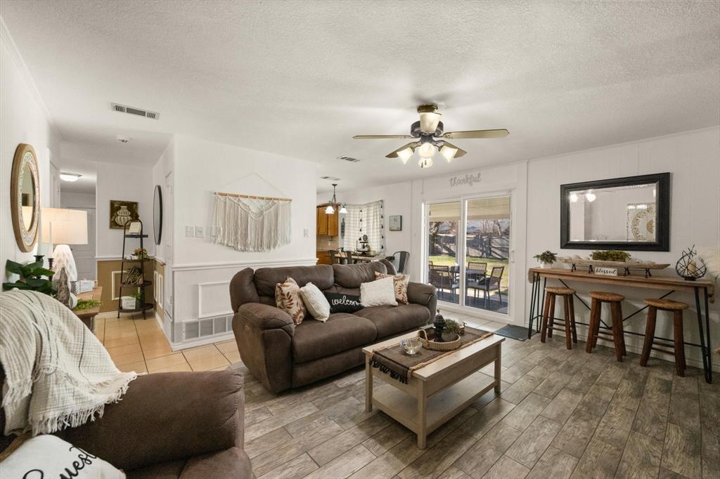 137 North Jessup Street Alvarado, TX 76009 - Photo 3 of 23 a living room with furniture kitchen view and a large window