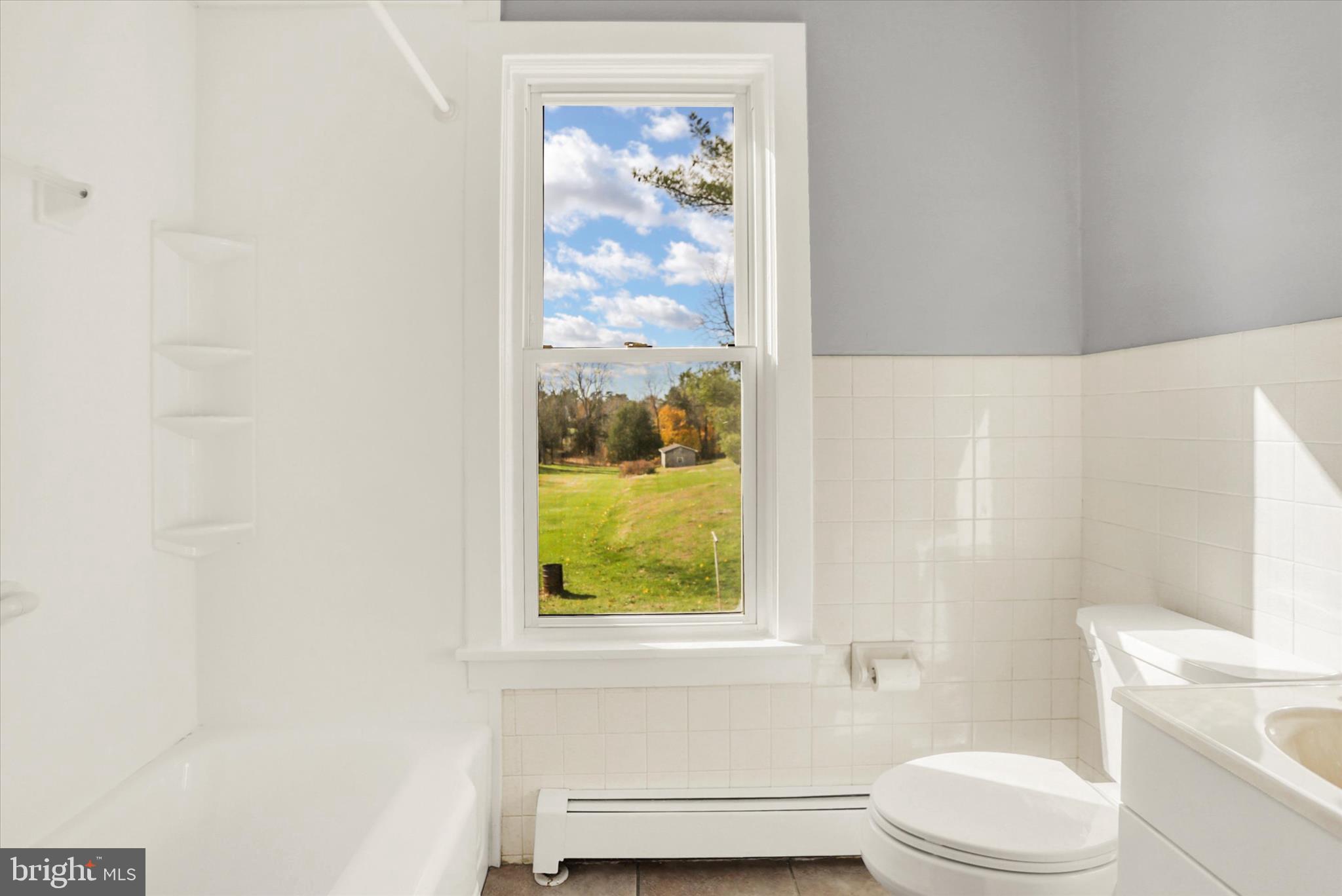 100 Roseglen Road Duncannon, PA 17020 - Photo 20 of 35 a bathroom with a toilet a sink and a bath tub