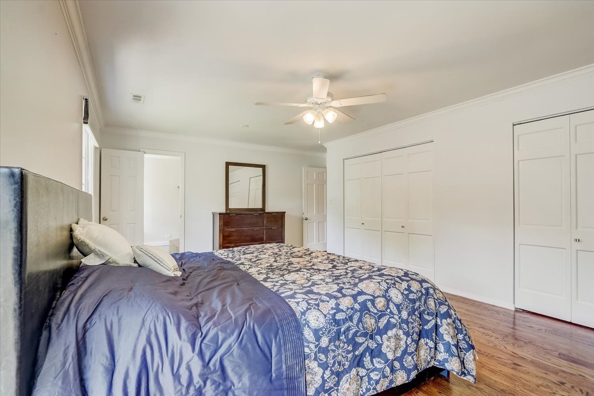2 Applejack Road Rolling Meadows, IL 60008 - Photo 24 of 61 a bedroom with a large bed and a chandelier