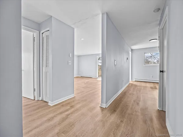 a view of entryway with wooden floor