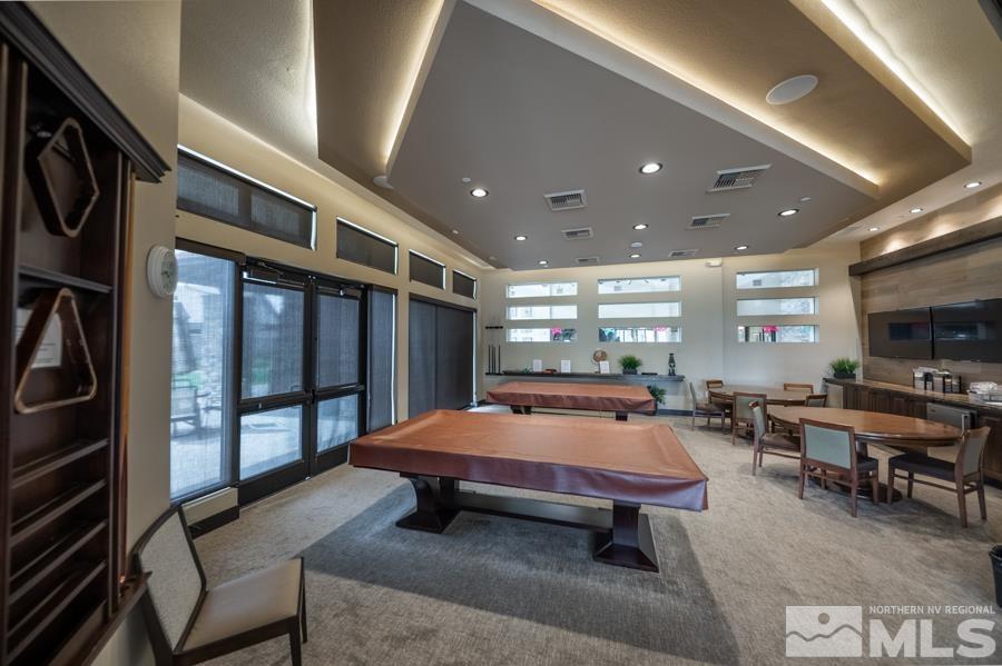 9840 Hafflinger Lane Reno, NV 89521 - Photo 34 of 38 a living room with pool table and flat screen tv