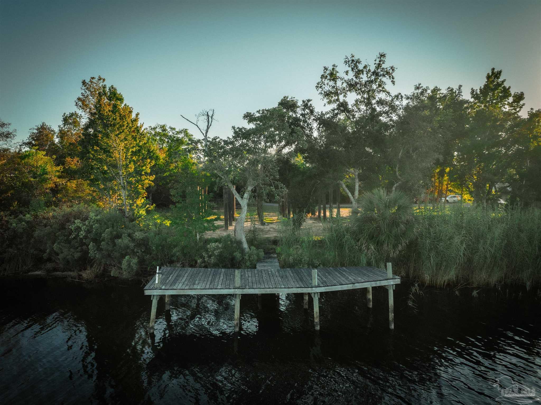 2022 Mackey Key Drive Pensacola, FL 32514 - Photo 8 of 15 a view of a lake with a mountain in the background
